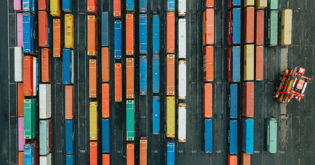 Aerial shot of colorful cargo containers in a logistics hub, Scotland.